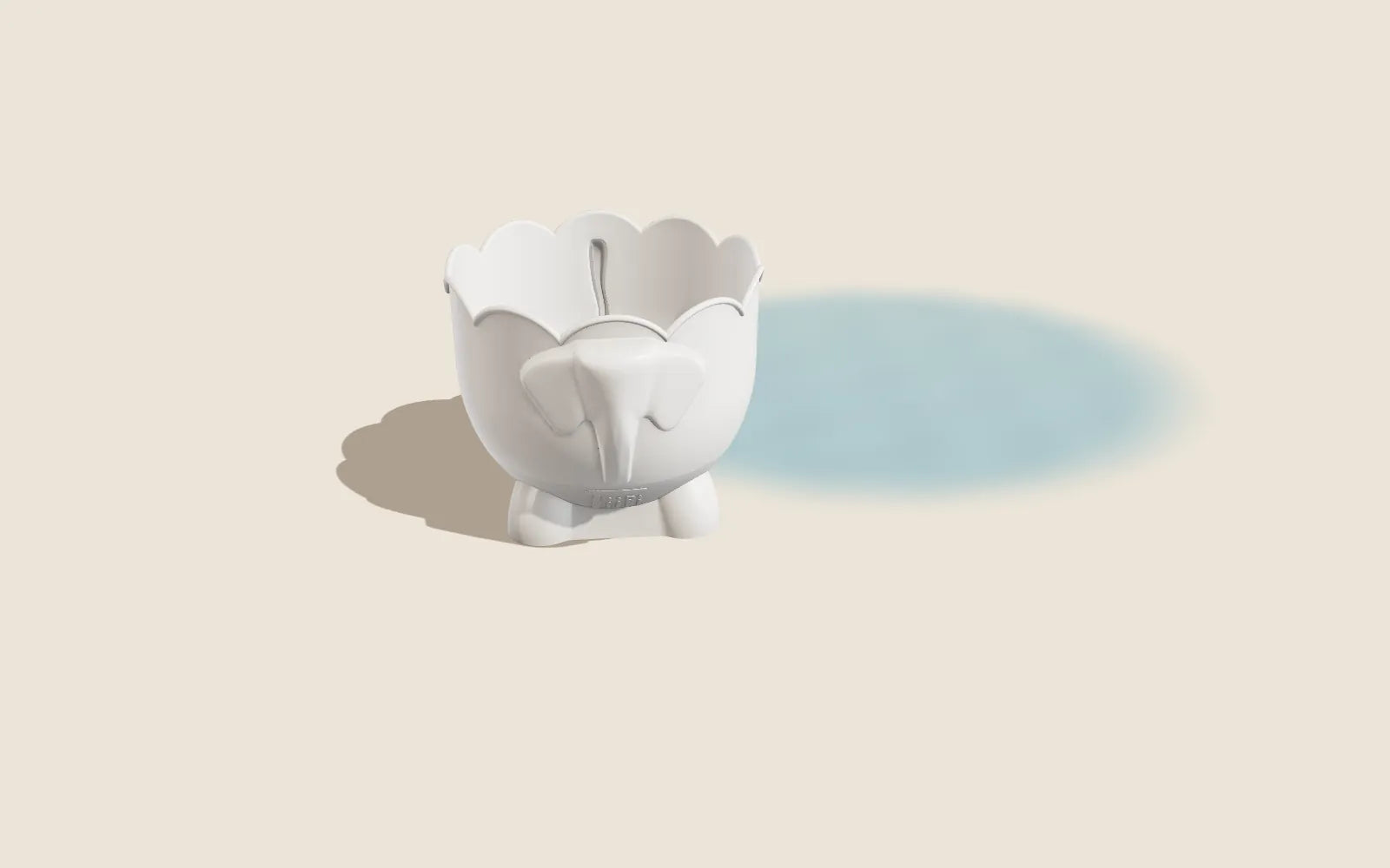 Bath Buddy, the cream elephant bath-toy drainer, facing you on a warm sand-coloured floor